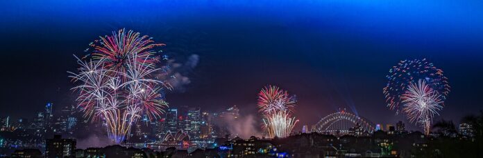 Rainbow-colored fireworks over Sydney Harbour on New Year's Eve